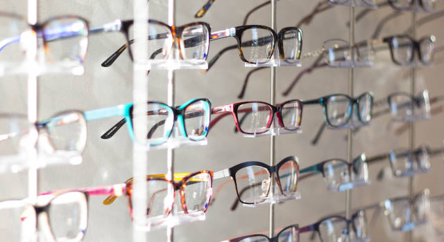 wall of eyeglasses with your optician 640×350