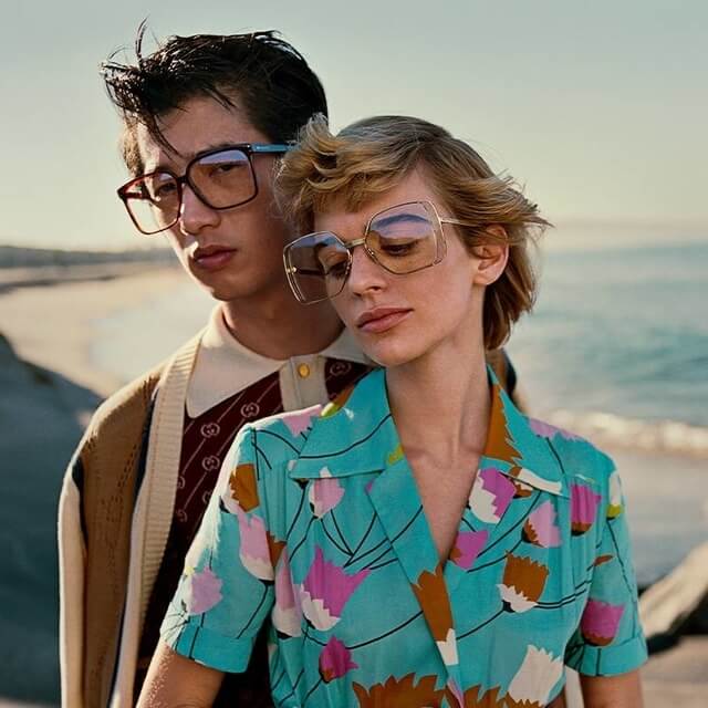 couple wearing gucci eyeglasses
