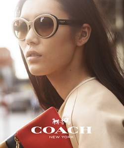 Model wearing Coach sunglasses