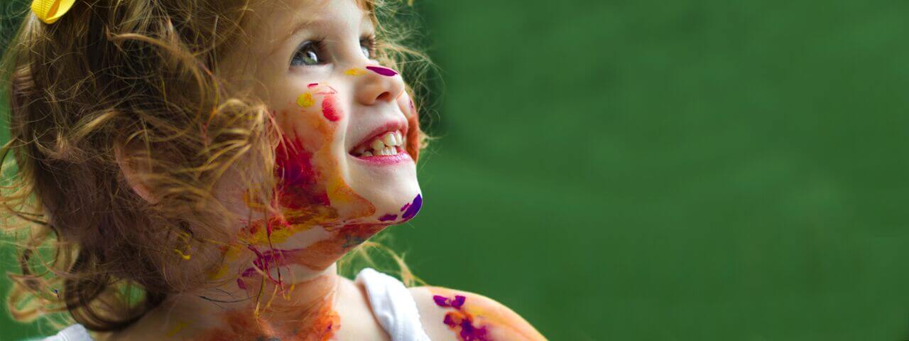 Child with amblyopia, with paint on face