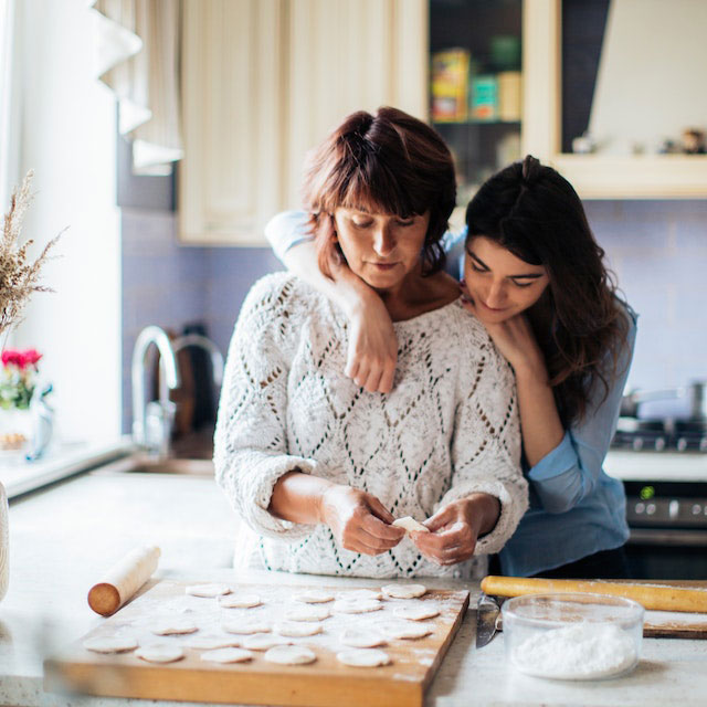 mom baking cookies with daughter