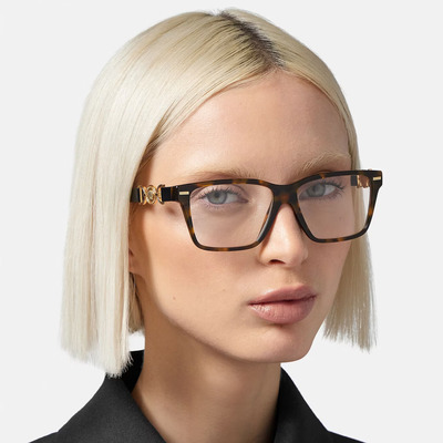 blond woman wearing brown colored versace eyeglasses