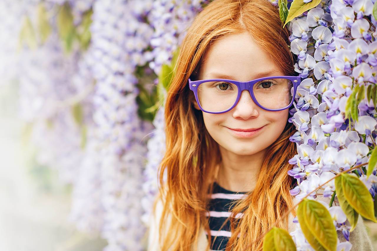 girl in purple glasses for vision therapy
