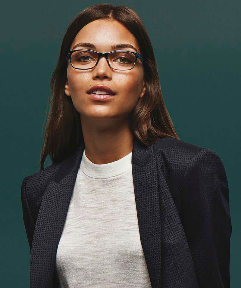 Woman wearing round designer eyeglasses