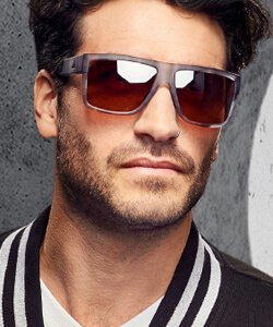 Model wearing Adidas sunglasses