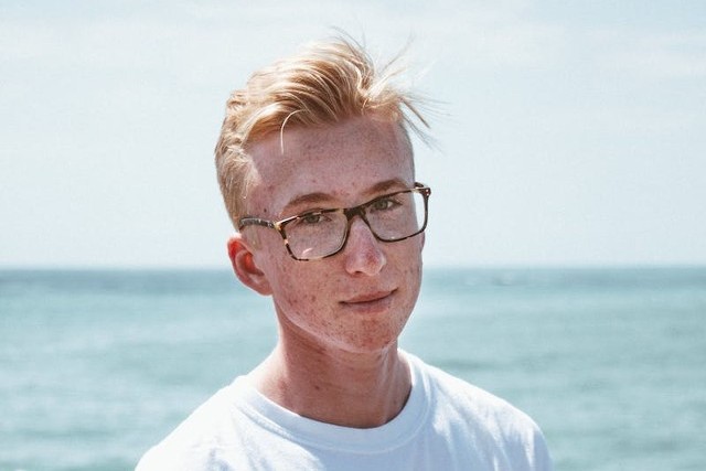 teenage boy wearing eyeglasses