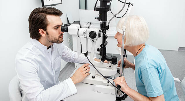 Senior with eye docotr having Eye Exam.jpg