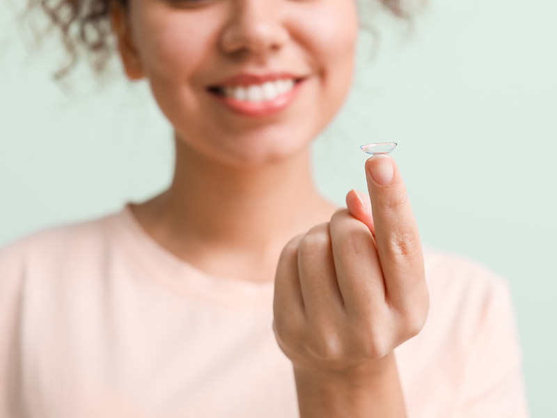 Female Holding Contact Lenses