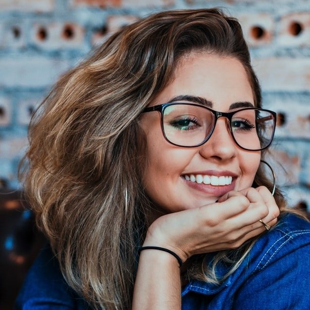 girl smiling wearing eyeglasses