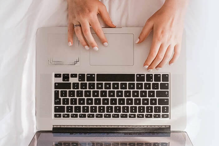 laptop top view hands
