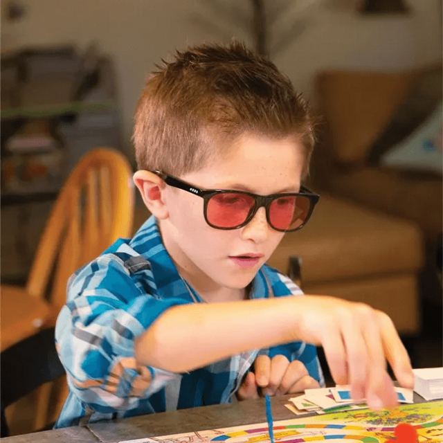 child wearing enchroma eyeglasses