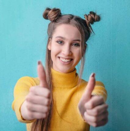 thumbs up blonde with blue background 640