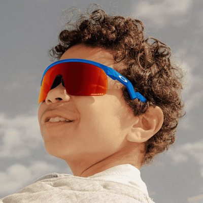 boy wearing orange oakley sunglasses