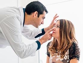 Doctor checking woman patient