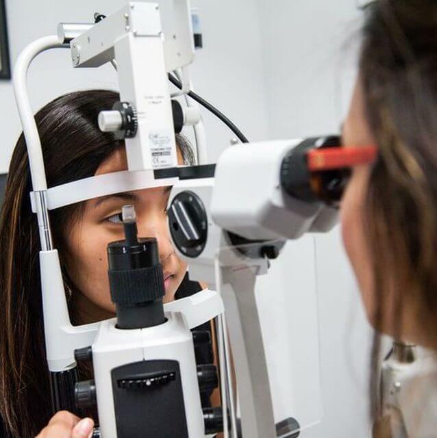 doctor performing an eye exam