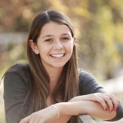 teen girl smiling brunette contacts ortho k 640px 427x427