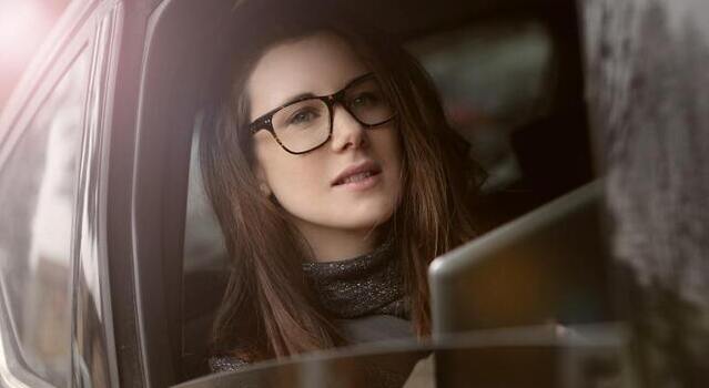 woman wearing eyeglasses in the car