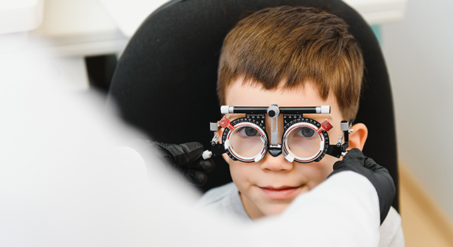 child having eyes tested