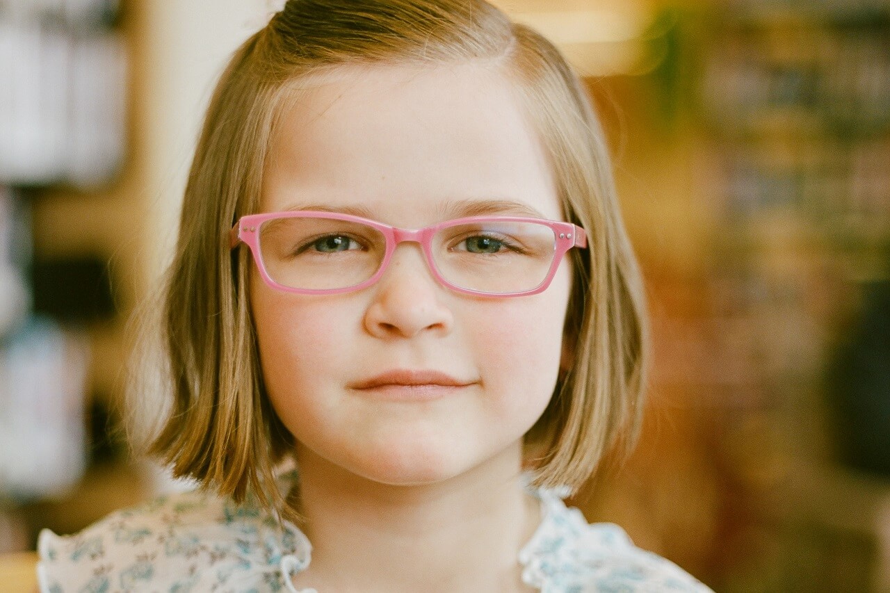 girl in pink eyeglasses