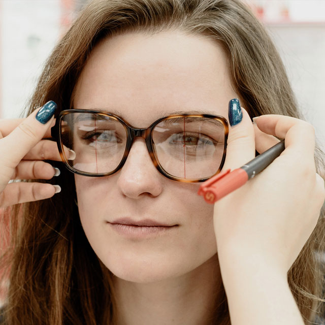 woman-trying-on-a-new-pair-of-glasses-640