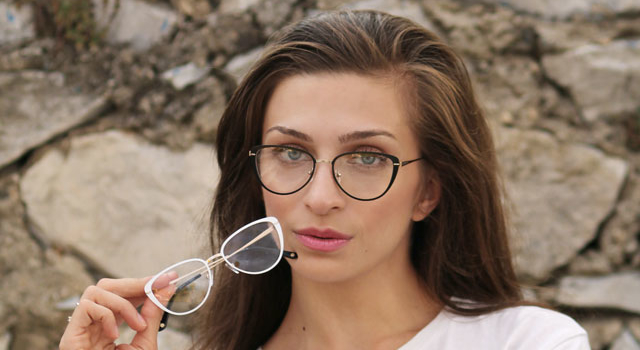 girl holding a pair of glasses 640.jpg