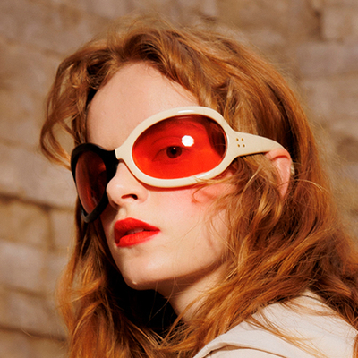 woman wearing red gucci eyeglasses 400x400