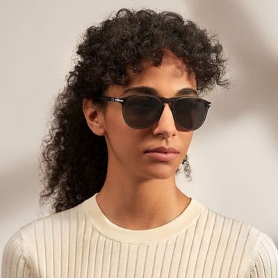 woman wearing dark persol sunglasses