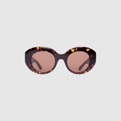 pair of amber balenciaga sunglasses