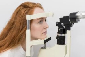 woman eye test optometrist
