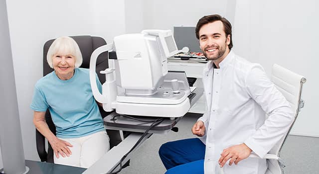 Smiling Optometrist low vision eye exam 640×350