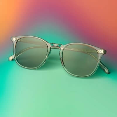 pai of garrett leight sunglasses on green and purple background min
