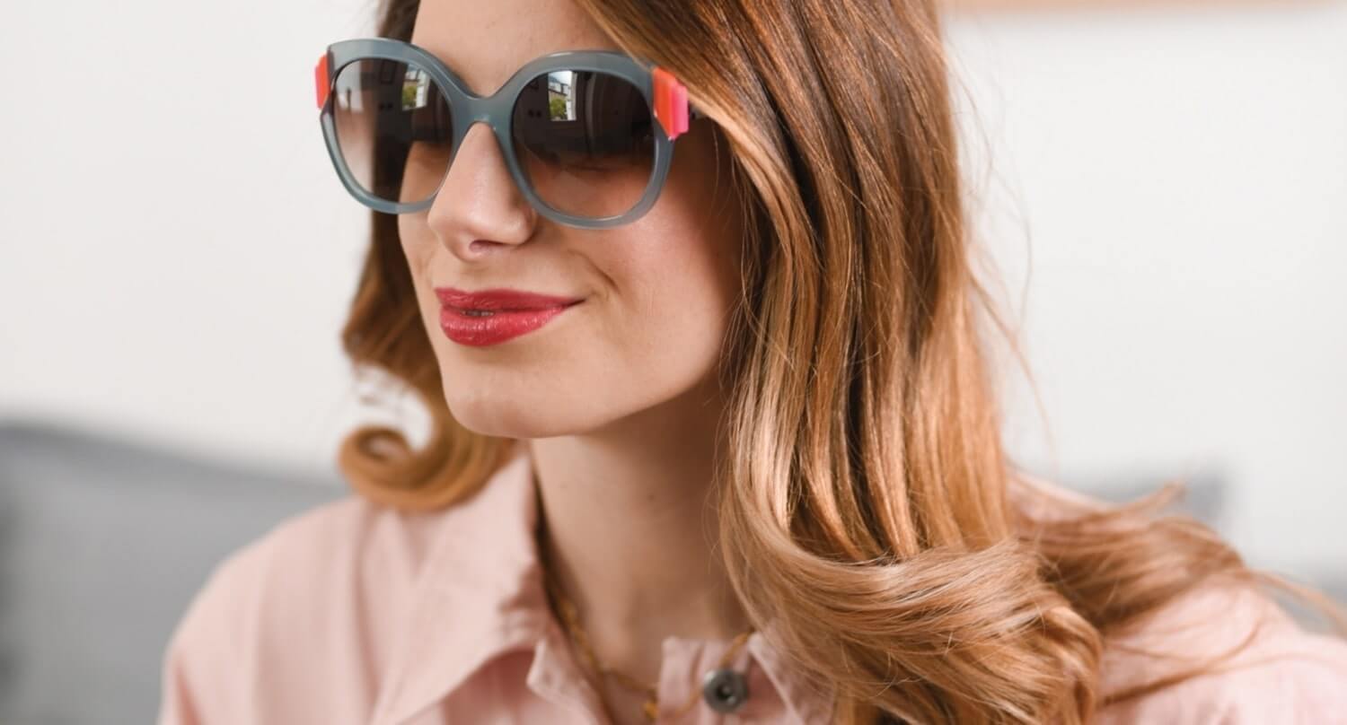 woman wearing face a face sunglasses hero