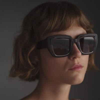 young woman wearing mykita sunglasses 400x400 min