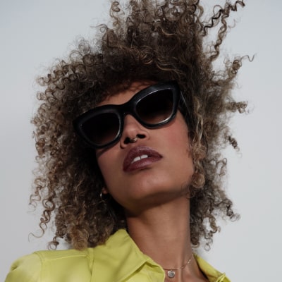 african american woman curly hair wearing blake kuwahara sunglasses 400x400 min