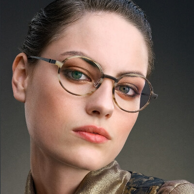 woman brown hair wearing lindberg eyeglasses 400x400