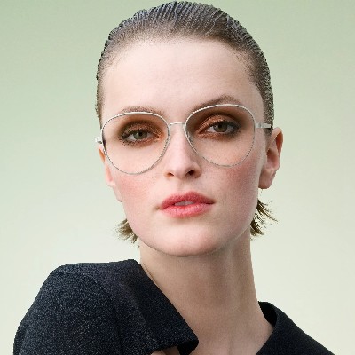 woman wearing round shaped lindberg eyewear