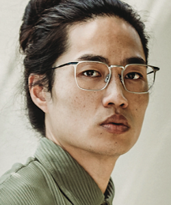 Asian man wearing State Optical eyeglasses
