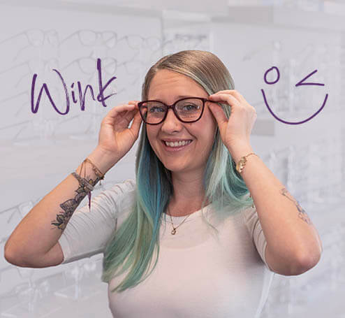 Girl with colored hair trying glasses