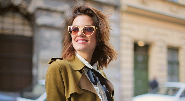 woman smiling wearing stylish sunglasses 640x350