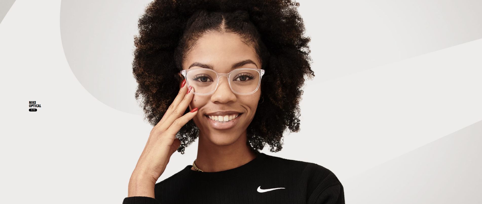 woman smiling wearing nike optical eyeglasses