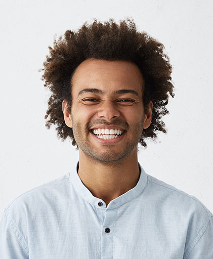 smiling man wearing contact lenses