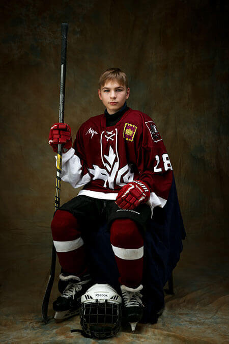 young hockey player in red