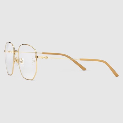 pair of gold metal rectangular gucci eyeglasses