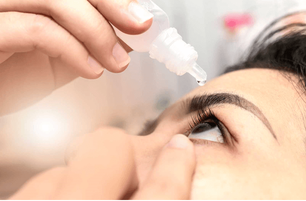 woman properly applying eye drops