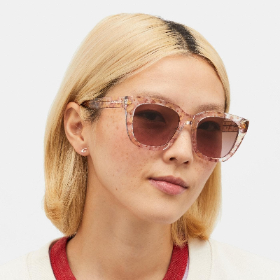 Coach Eyewear Woman wearing polarized sunglasses.jpg