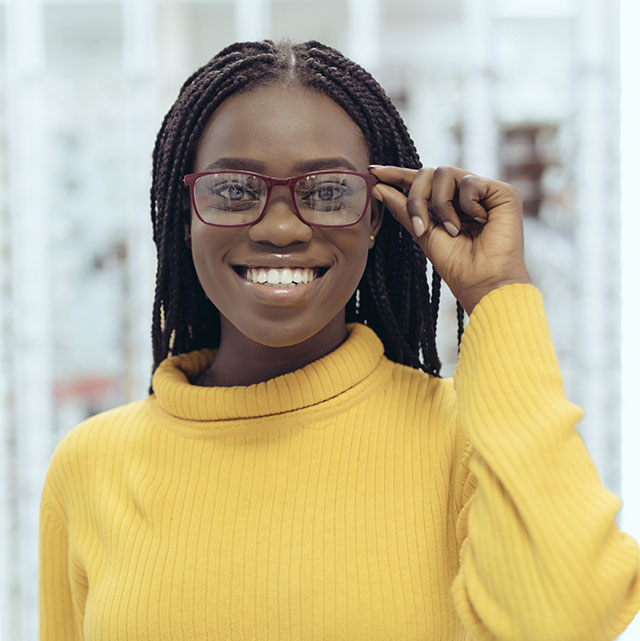 african american woman showing glasses yellow sweater