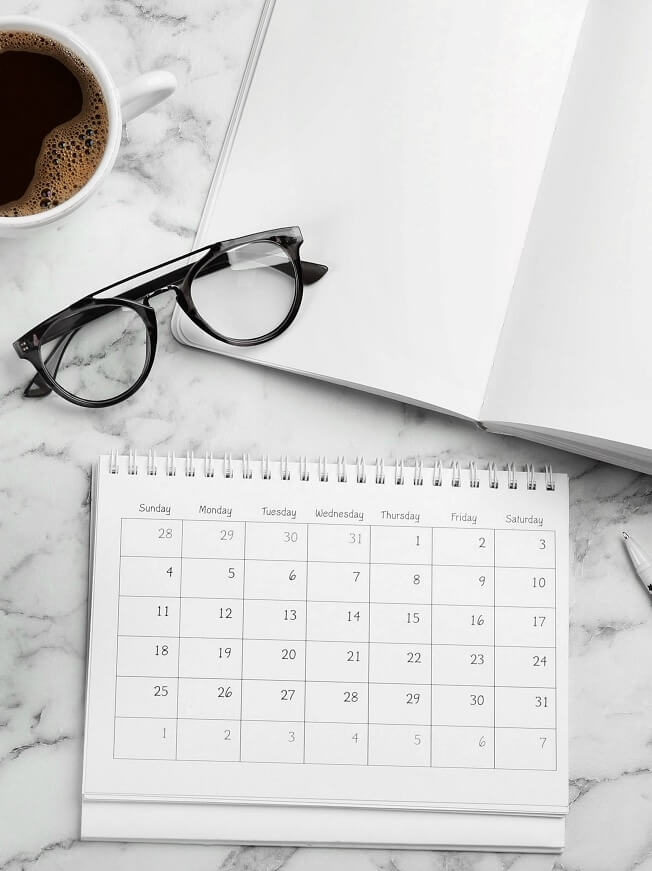 desk calendar keyboard coffee eyeglasses