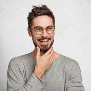 smiling man wearing eyeglasses
