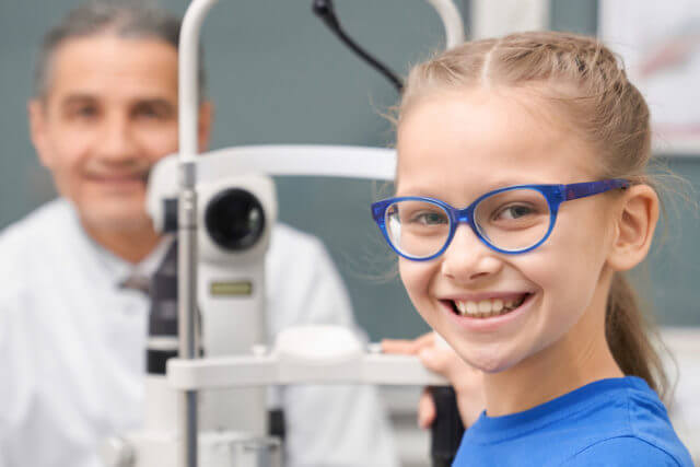 girl having eye exam in Arlington