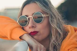 woman gold sunglasses thumbnail